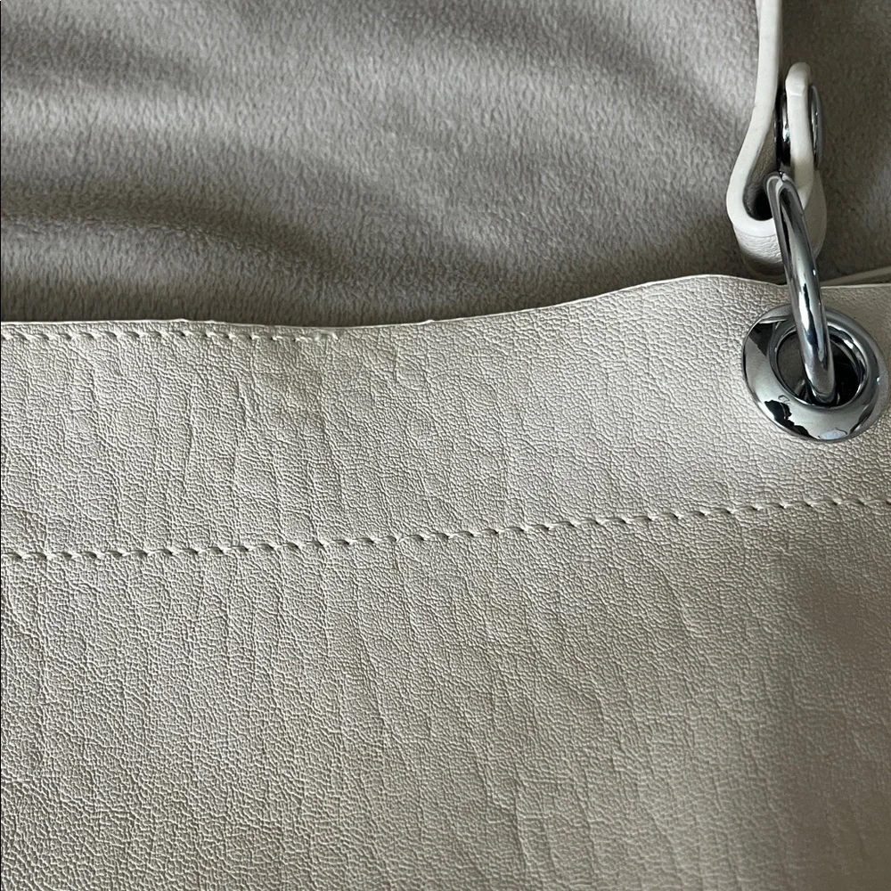 Madison West Purse in a purse
Cream purse w/ silver details. - Picture 6 of 6